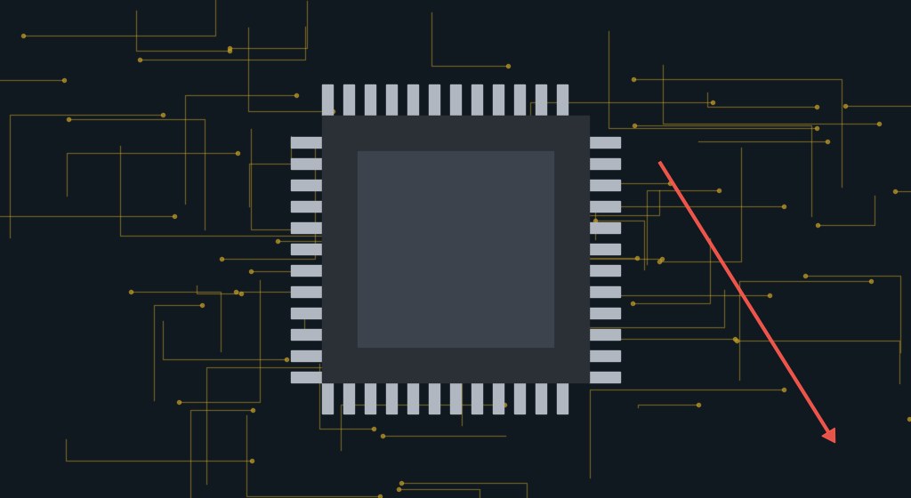 Computerchip auf einer Platine mit rotem Pfeil nach unten als Symbol für fallende Chipaktien